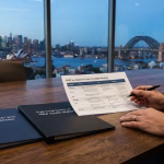 A professional top-down, close-up landscape header image of a legal workspace comparing court and tribunal jurisdictions in New South Wales. On a polished wooden boardroom desk, a lawyer’s hands review side-by-side files: a case folder labeled "NSW Civil and Administrative Tribunal (NCAT) Case File" and a legal binder labeled "Supreme Court of New South Wales | Commercial Litigation Brief." A classic fountain pen rests beside a printed forum comparison checklist detailing jurisdiction and cost structures.